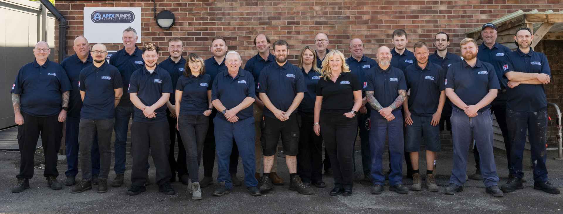 The 22 person staff team outside the Apex Pumps building